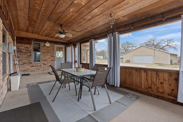 unfurnished sunroom with wood ceiling