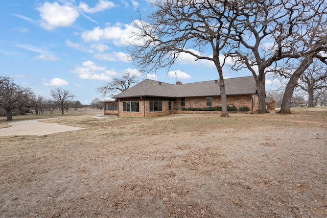 exterior space featuring a lawn and a patio