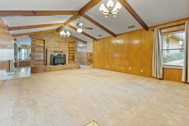 unfurnished living room with carpet, vaulted ceiling with beams, wooden walls, built in features, and heating unit