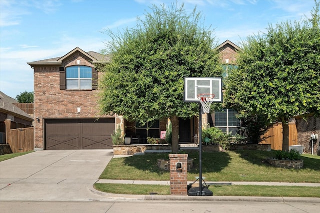 view of front of house featuring a garage and a front yard