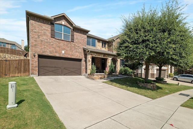 view of front of house with a garage and a front lawn