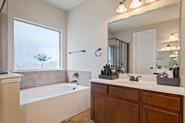 bathroom with vanity, a wealth of natural light, shower with separate bathtub, and tile patterned flooring