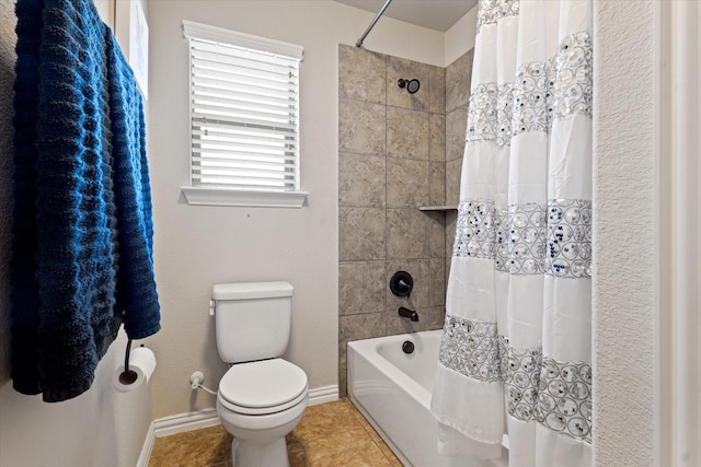 bathroom with shower / bath combo, toilet, and tile patterned floors