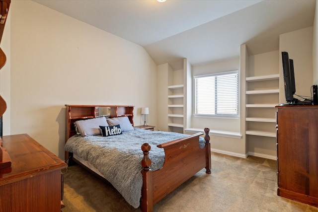 bedroom with light carpet and vaulted ceiling