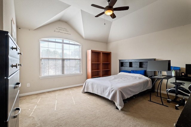 carpeted bedroom with vaulted ceiling and ceiling fan