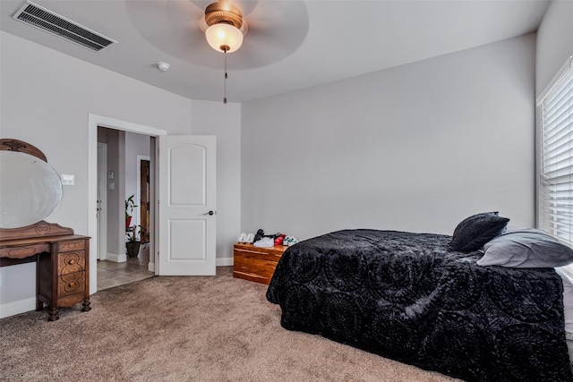 bedroom with light carpet and ceiling fan