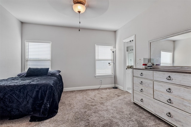 bedroom featuring light carpet and ceiling fan