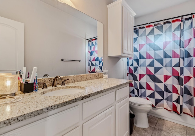 full bathroom with tile patterned floors, toilet, vanity, and shower / tub combo