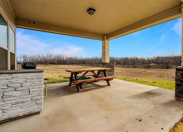 view of patio / terrace with a rural view