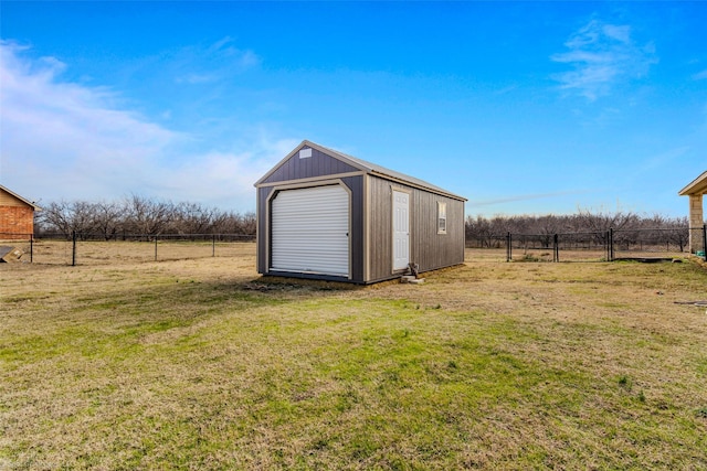 view of outdoor structure with a yard and a rural view