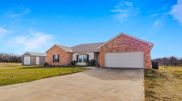 single story home with a garage and a front yard