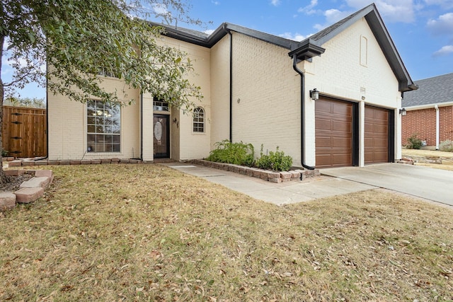 view of front facade with a garage and a front yard