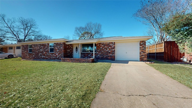 ranch-style home with a front lawn and a garage