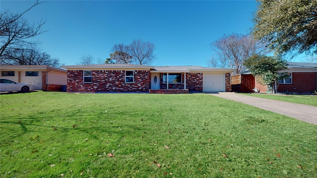 single story home featuring a garage and a front yard