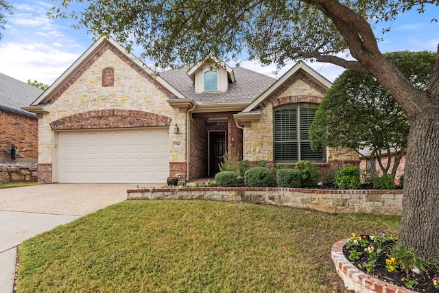 view of front of home featuring a garage and a front lawn