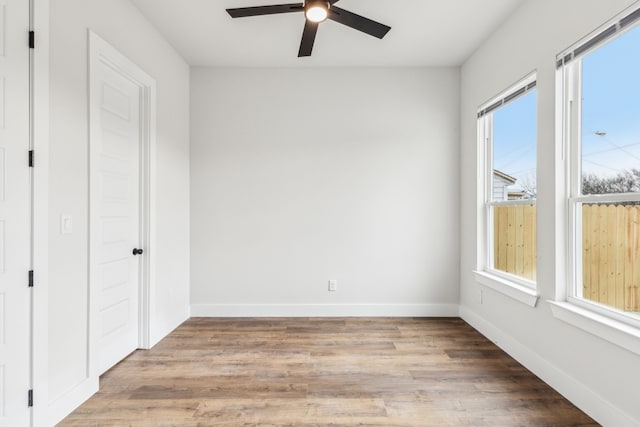 unfurnished bedroom with ceiling fan and light hardwood / wood-style flooring