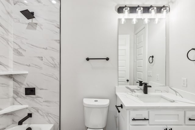 full bathroom with vanity, toilet, and tiled shower / bath