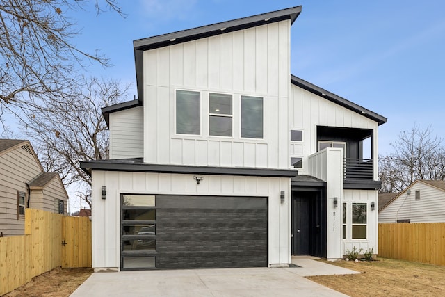 modern farmhouse featuring a balcony and a garage