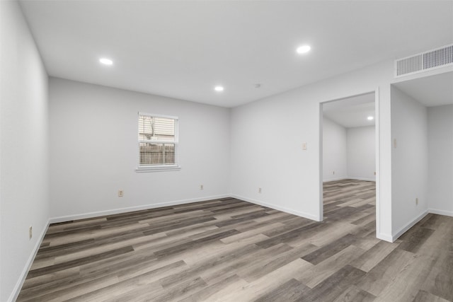 spare room featuring dark hardwood / wood-style floors