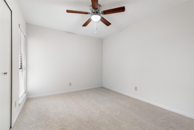 unfurnished bedroom featuring ceiling fan and light carpet