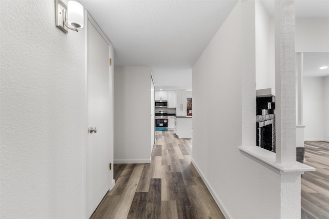 hallway featuring wood-type flooring