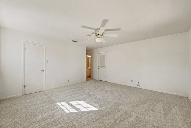 unfurnished room featuring ceiling fan and light colored carpet