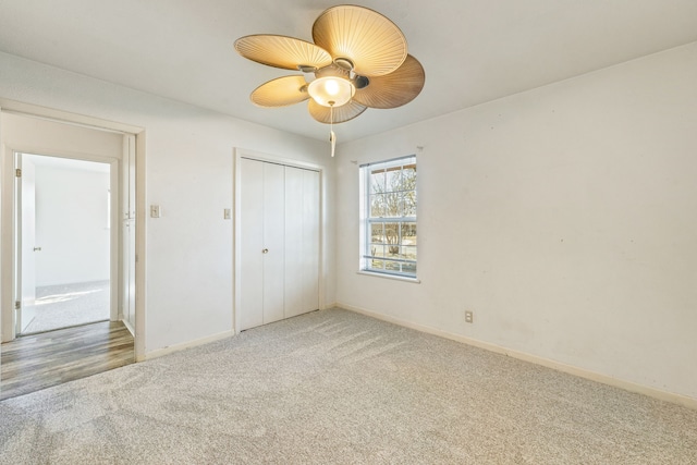 unfurnished bedroom featuring a closet, ceiling fan, and carpet floors