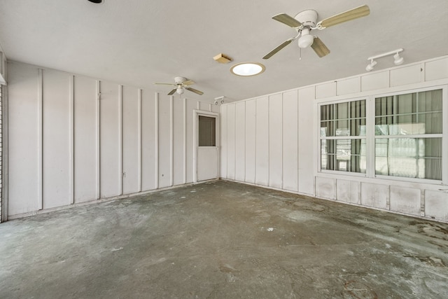 interior space with ceiling fan