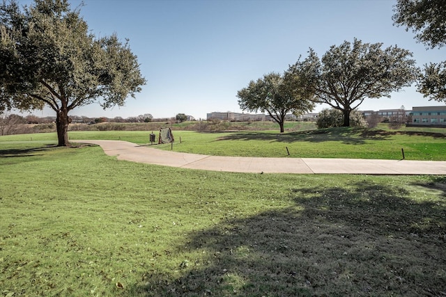 view of property's community featuring a yard