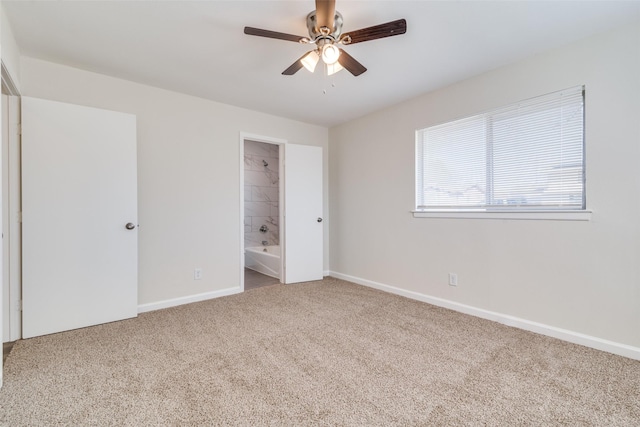 unfurnished bedroom featuring ceiling fan, carpet, and connected bathroom