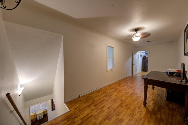 office area with wood-type flooring and ceiling fan