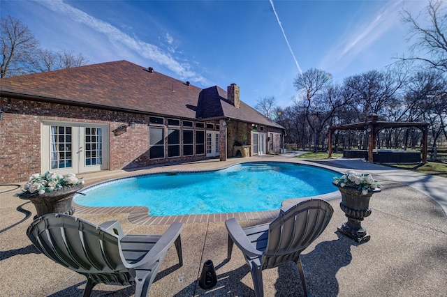 view of swimming pool featuring a patio, a gazebo, and french doors