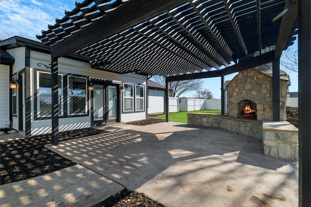 view of patio / terrace featuring a pergola and an outdoor stone fireplace