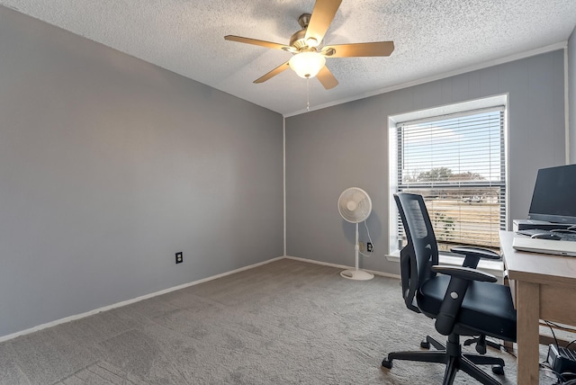 carpeted office space with ceiling fan and a textured ceiling