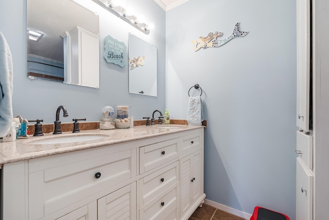 bathroom with ornamental molding, tile patterned flooring, and vanity