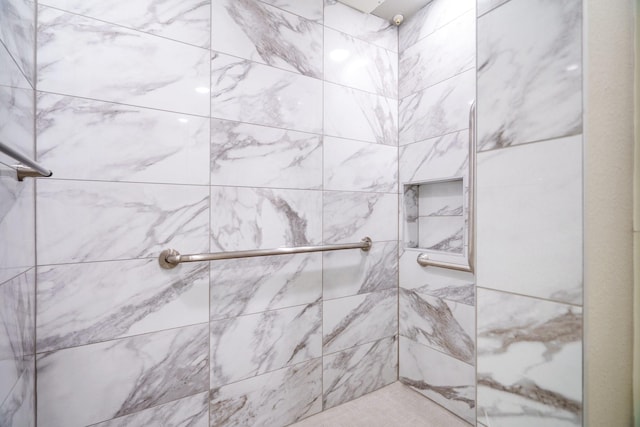 bathroom with tiled shower