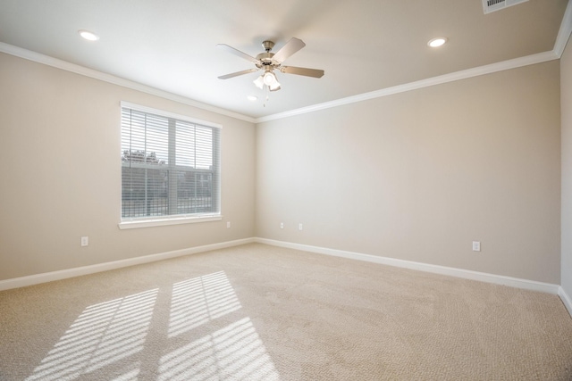 unfurnished room featuring light carpet, ceiling fan, and crown molding