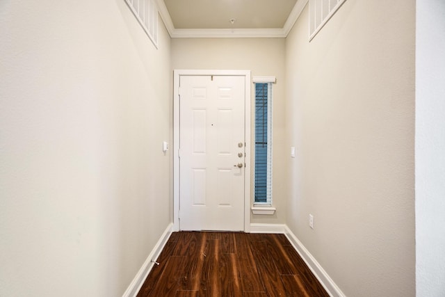 doorway featuring crown molding and dark hardwood / wood-style flooring