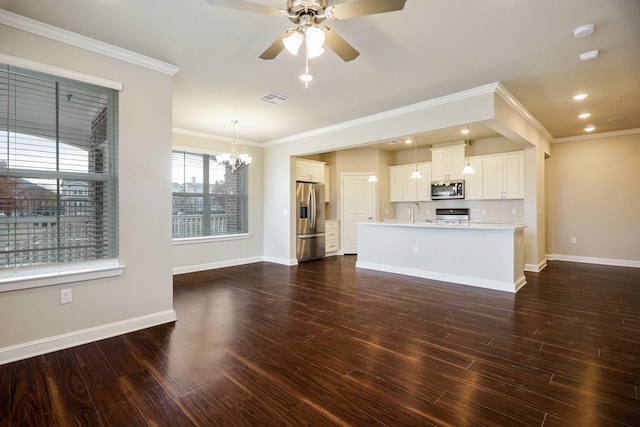 unfurnished living room featuring sink, ornamental molding, ceiling fan with notable chandelier, and dark hardwood / wood-style flooring