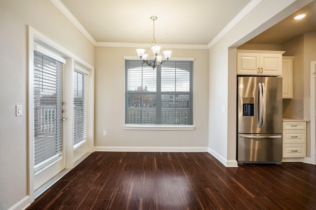 unfurnished dining area featuring a wealth of natural light, crown molding, and dark hardwood / wood-style floors