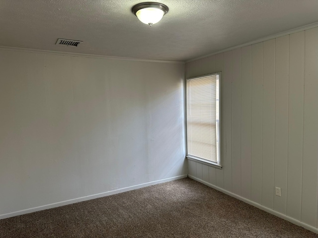 unfurnished room featuring crown molding, plenty of natural light, and carpet