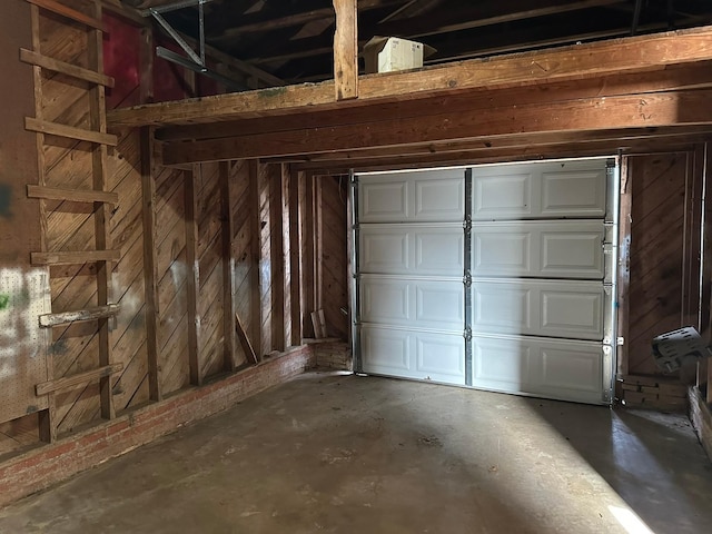 garage featuring wood walls