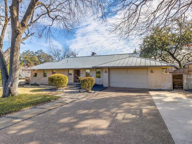 single story home featuring a garage