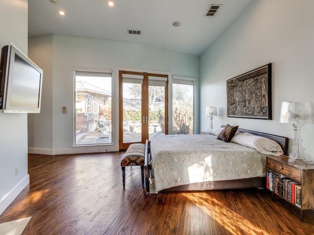 bedroom featuring dark wood-type flooring, access to outside, french doors, and vaulted ceiling