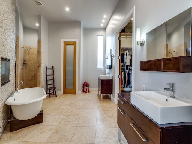 bathroom featuring vanity, separate shower and tub, and tile patterned flooring