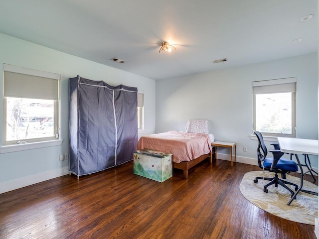 bedroom featuring dark wood-type flooring