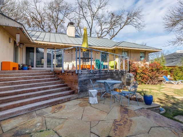 back of house featuring a patio and french doors