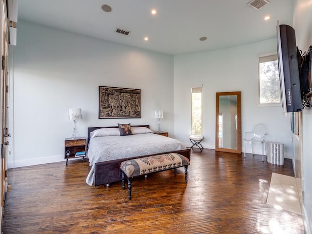 bedroom featuring dark hardwood / wood-style flooring