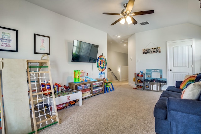 recreation room featuring ceiling fan, carpet, and lofted ceiling