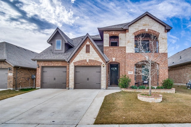 view of front of house with a garage and a front yard